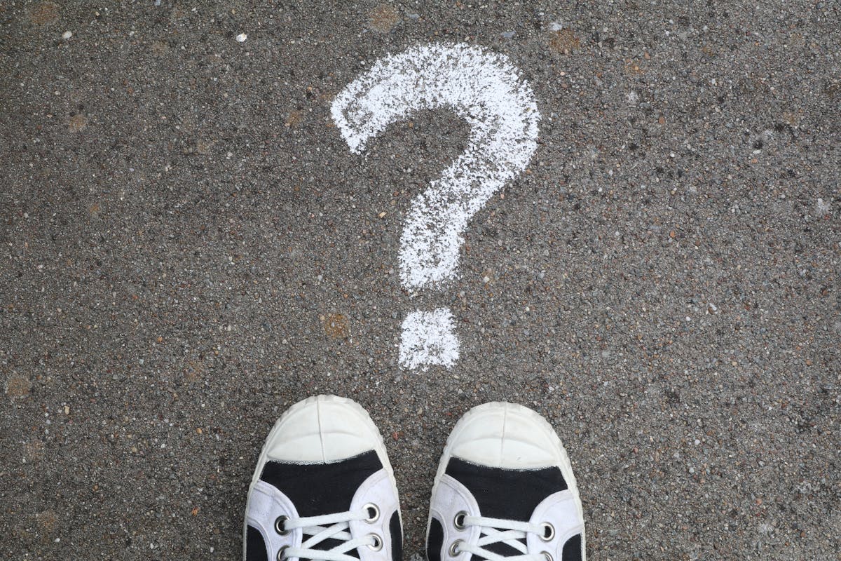 a pair of shoes and a question mark
